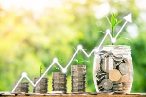 step of coins stacks with tree growing on top and Stock market o step of coins stacks with tree growing on top and Stock market or forex trading graph, nature background, money, saving and investment or family planning, stock market concept.
